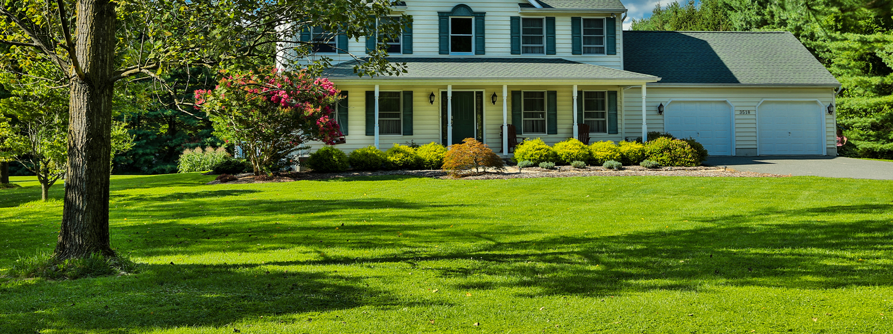 back yard with amazing landscaping, small garden, and seating area